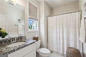 3617 Carson Ln SE, Smyrna, GA 30080 - bathroom featuring vanity, toilet, and a shower with shower curtain