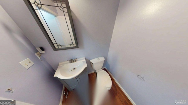 2422 Williams Mill Rd, Zebulon, GA 30295 - bathroom featuring toilet, vanity, and baseboards