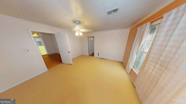 2422 Williams Mill Rd, Zebulon, GA 30295 - carpeted empty room with crown molding, baseboards, and a ceiling fan