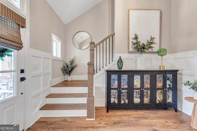 141 Alaina Rd, Canton, GA 30115 - entryway featuring stairs, high vaulted ceiling, and wood finished floors