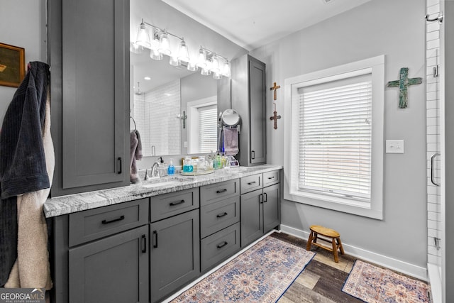 2109 Brewers Mill Rd, Elberton, GA 30635 - full bathroom featuring a stall shower, healthy amount of natural light, double vanity, and wood finished floors