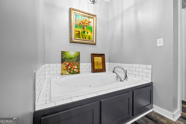 2109 Brewers Mill Rd, Elberton, GA 30635 - bathroom with a garden tub, wood finished floors, and baseboards