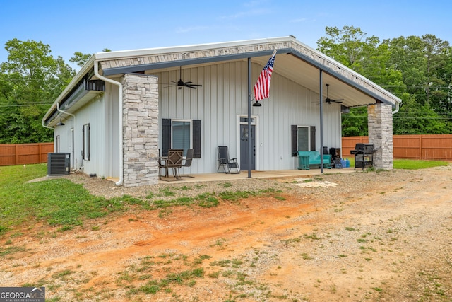 2109 Brewers Mill Rd, Elberton, GA 30635 - back of property featuring a ceiling fan, a patio, central air condition unit, and board and batten siding
