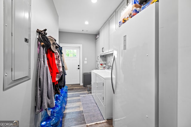 2109 Brewers Mill Rd, Elberton, GA 30635 - laundry area featuring cabinet space, washer and dryer, wood finished floors, recessed lighting, and electric panel