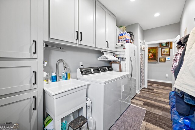 2109 Brewers Mill Rd, Elberton, GA 30635 - laundry room featuring separate washer and dryer, cabinet space, dark wood-type flooring, and recessed lighting