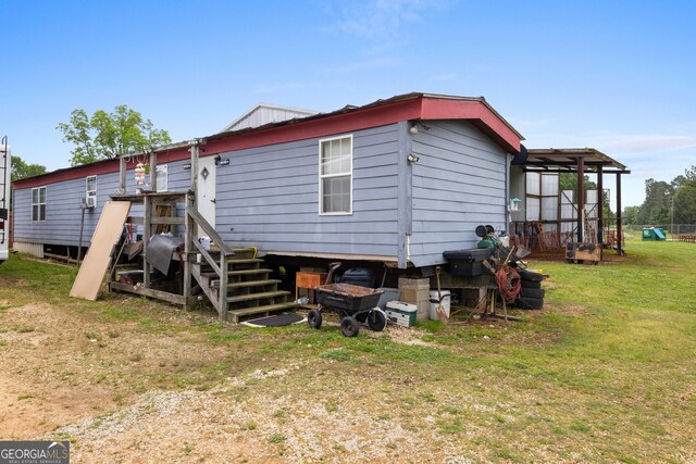 2109 Brewers Mill Rd, Elberton, GA 30635 - rear view of property with a lawn