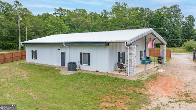 2109 Brewers Mill Rd, Elberton, GA 30635 - rear view of house featuring a patio, metal roof, and central air condition unit