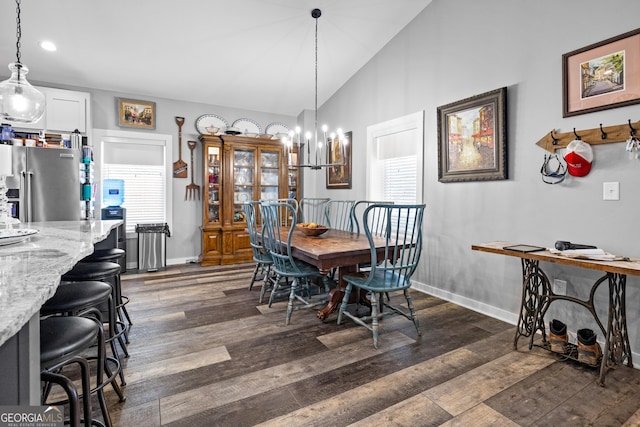 2109 Brewers Mill Rd, Elberton, GA 30635 - dining room with dark wood finished floors, a chandelier, lofted ceiling, baseboards, and recessed lighting