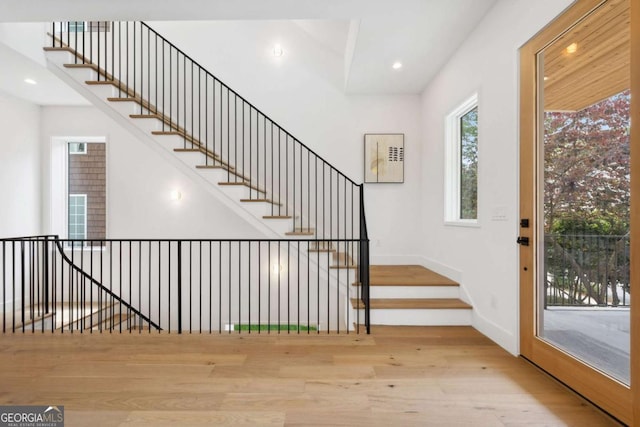1287 Star Dr NE, Brookhaven, GA 30319 - foyer featuring wood finished floors, baseboards, recessed lighting, and stairs