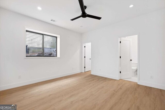 1287 Star Dr NE, Brookhaven, GA 30319 - unfurnished bedroom featuring light wood-style flooring, baseboards, recessed lighting, and connected bathroom