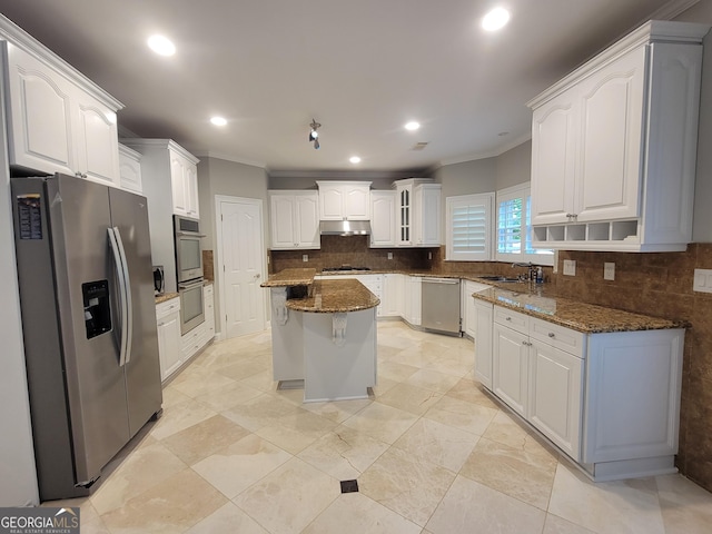 45 Mountain Crest Dr, Oxford, GA 30054 - kitchen featuring stainless steel appliances, crown molding, under cabinet range hood, a sink, and tasteful backsplash