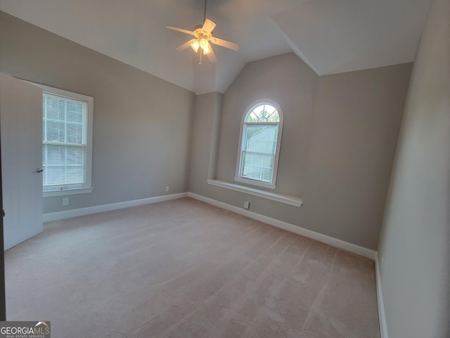 45 Mountain Crest Dr, Oxford, GA 30054 - spare room with light colored carpet, baseboards, a ceiling fan, and vaulted ceiling