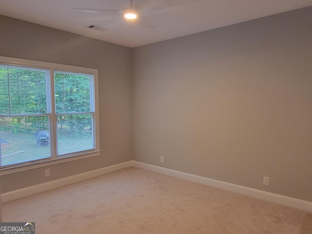 45 Mountain Crest Dr, Oxford, GA 30054 - unfurnished room featuring light carpet, ceiling fan, healthy amount of natural light, and baseboards