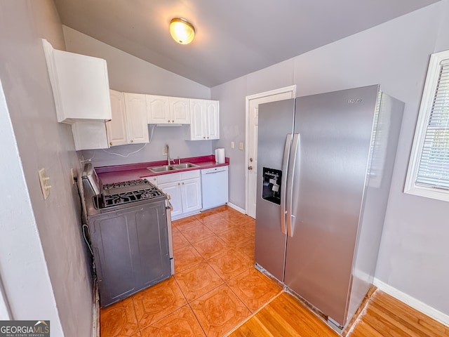 3082 Dove Way, Decatur, GA 30033 - kitchen with stainless steel appliances, a sink, white cabinets, lofted ceiling, and baseboards