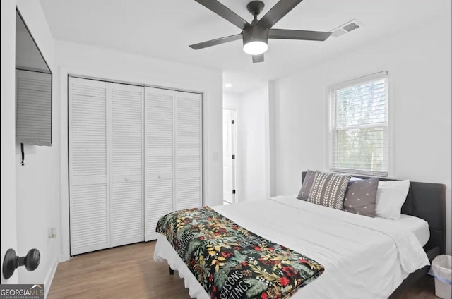 251 Aurora Ave NW, Atlanta, GA 30314 - bedroom with wood finished floors, a closet, a ceiling fan, and baseboards