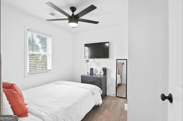 251 Aurora Ave NW, Atlanta, GA 30314 - bedroom with wood finished floors, a ceiling fan, and baseboards