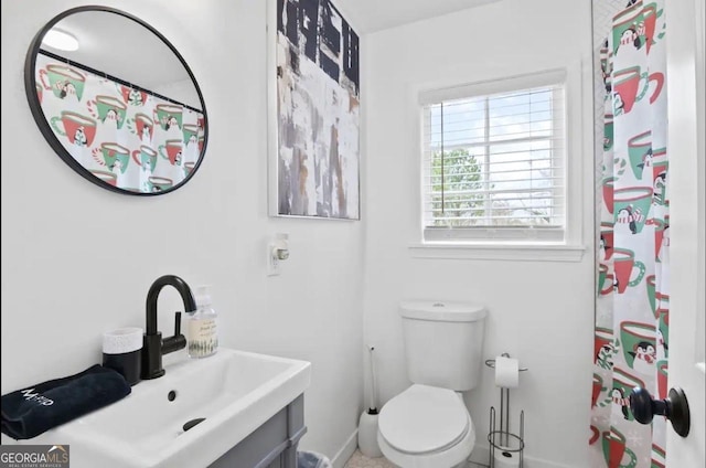 251 Aurora Ave NW, Atlanta, GA 30314 - bathroom with vanity, toilet, a shower with shower curtain, and baseboards