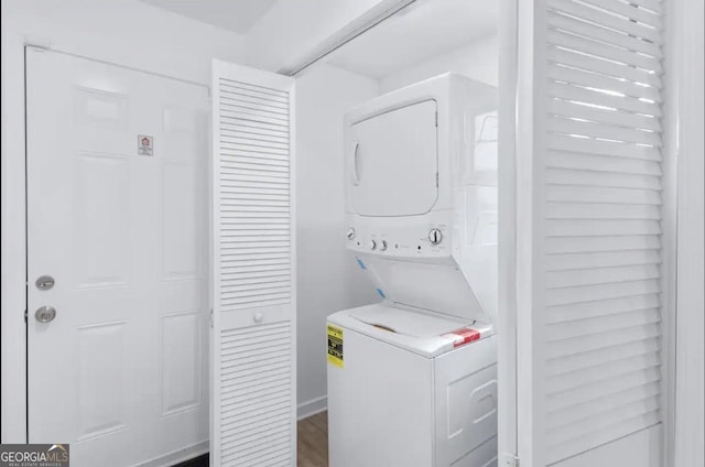 251 Aurora Ave NW, Atlanta, GA 30314 - laundry room featuring stacked washer / dryer and wood finished floors