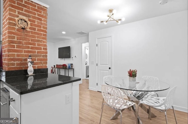 251 Aurora Ave NW, Atlanta, GA 30314 - kitchen featuring a chandelier, light wood finished floors, baseboards, white cabinets, and recessed lighting