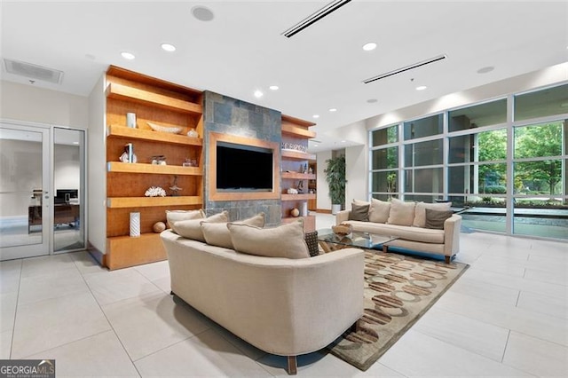 3300 Windy Rdg Unit 1107, Atlanta, GA 30339 - living area featuring recessed lighting, light tile patterned floors, french doors, and built in shelves