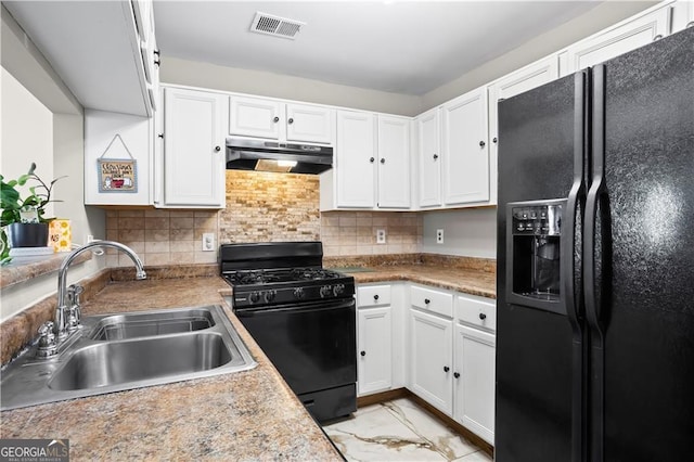 2540 Park Ave, Austell, GA 30106 - kitchen featuring black appliances, under cabinet range hood, a sink, white cabinets, and light marble finish floors