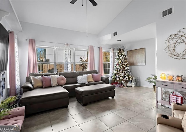 2540 Park Ave, Austell, GA 30106 - living area featuring ceiling fan, light tile patterned flooring, high vaulted ceiling, and baseboards