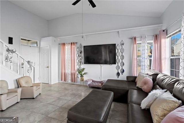 2540 Park Ave, Austell, GA 30106 - living area with ceiling fan, light tile patterned floors, stairway, and high vaulted ceiling