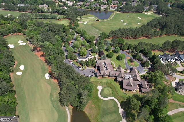1023 Little Darby Ln, Suwanee, GA 30024 - aerial overview of property's location featuring a nearby body of water, a local golf course, and a tree filled landscape
