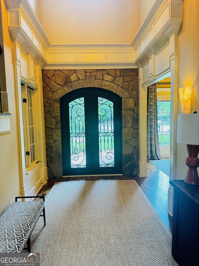 1023 Little Darby Ln, Suwanee, GA 30024 - foyer entrance with wood finished floors, arched walkways, and french doors
