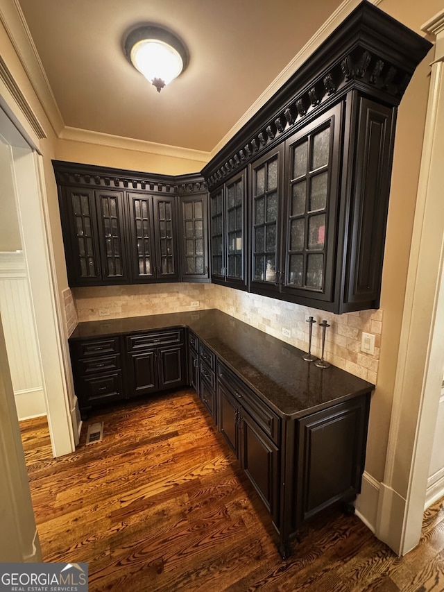 1023 Little Darby Ln, Suwanee, GA 30024 - bar with tasteful backsplash, dark wood finished floors, and crown molding