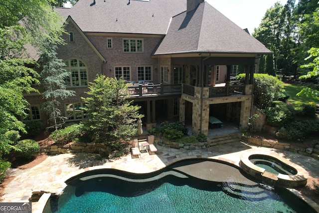 1023 Little Darby Ln, Suwanee, GA 30024 - rear view of property with a patio area, a shingled roof, an outdoor pool, an in-ground hot tub, and a chimney