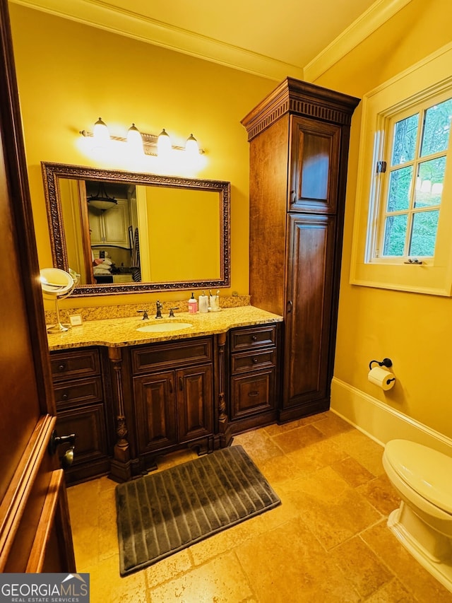 1023 Little Darby Ln, Suwanee, GA 30024 - bathroom with ornamental molding, vanity, toilet, and baseboards