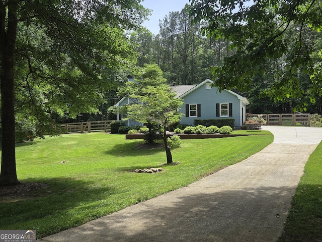 55 Hubbard Ct, Newnan, GA 30263 - view of front of house with driveway and view of wooded area