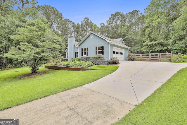 55 Hubbard Ct, Newnan, GA 30263 - view of front of house with driveway, a garage, and a chimney