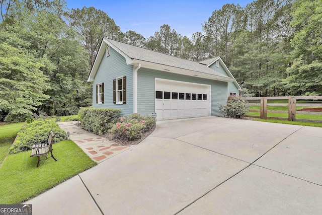 55 Hubbard Ct, Newnan, GA 30263 - view of side of property featuring an attached garage and driveway