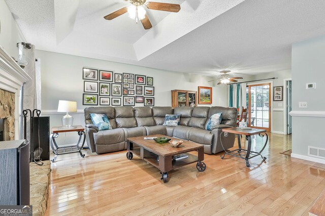 55 Hubbard Ct, Newnan, GA 30263 - living area with a ceiling fan, light wood finished floors, and a textured ceiling