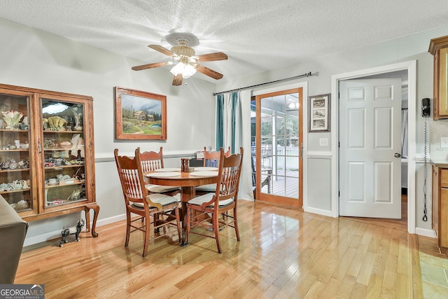 55 Hubbard Ct, Newnan, GA 30263 - dining area featuring light wood finished floors, a ceiling fan, and a textured ceiling
