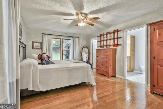 55 Hubbard Ct, Newnan, GA 30263 - bedroom featuring light wood-style flooring, a textured ceiling, ensuite bath, and ceiling fan