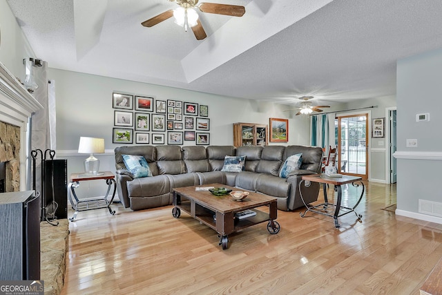 55 Hubbard Ct, Newnan, GA 30263 - living room featuring ceiling fan, light wood finished floors, a textured ceiling, and baseboards