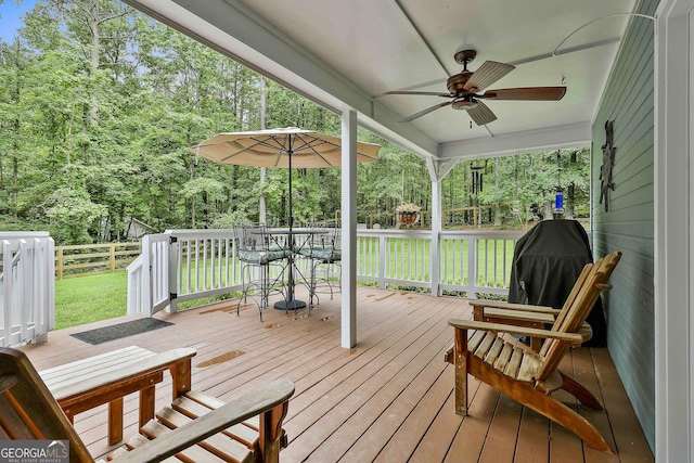 55 Hubbard Ct, Newnan, GA 30263 - wooden deck featuring ceiling fan, a yard, and outdoor dining space