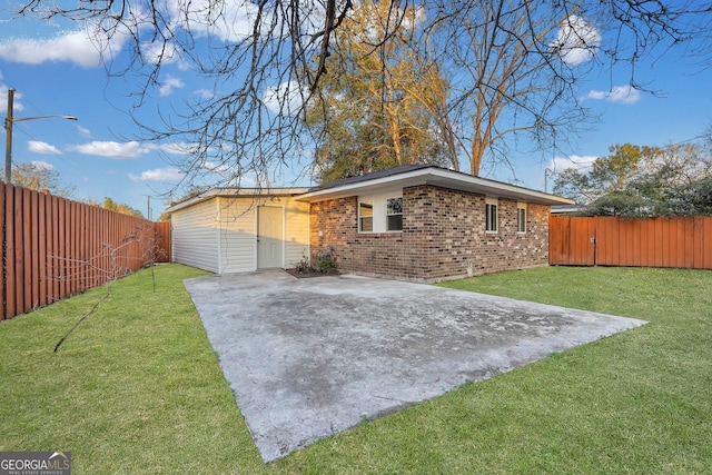 view of home's exterior featuring brick siding and a patio area