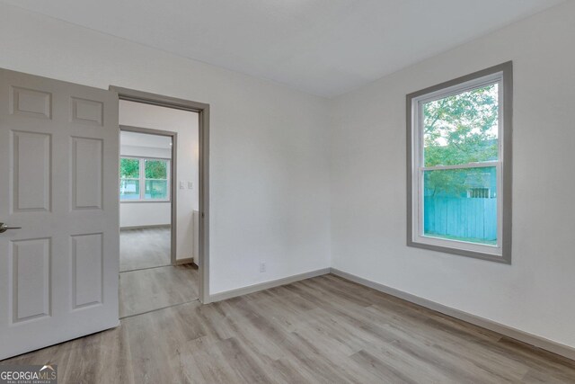 1601 Coventry St, Savannah, GA 31415 - empty room featuring light wood-style floors and baseboards