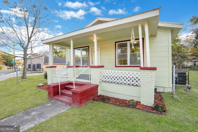 1601 Coventry St, Savannah, GA 31415 - view of front facade with a front lawn and a porch