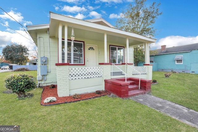 1601 Coventry St, Savannah, GA 31415 - view of front of property featuring a front yard and covered porch
