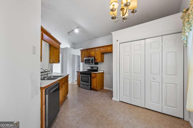 7920 Silversmith Dr, Cumming, GA 30028 - kitchen featuring appliances with stainless steel finishes, a sink, brown cabinets, a chandelier, and light countertops