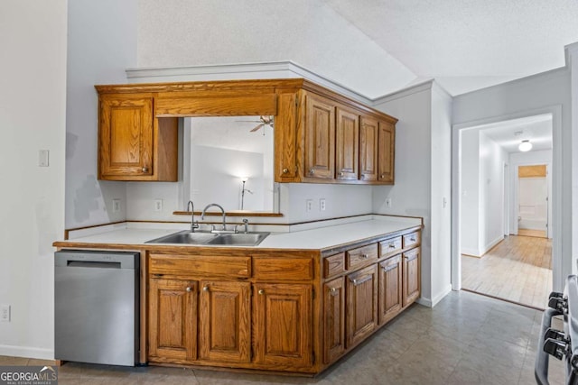7920 Silversmith Dr, Cumming, GA 30028 - kitchen with appliances with stainless steel finishes, a sink, brown cabinetry, light countertops, and ceiling fan