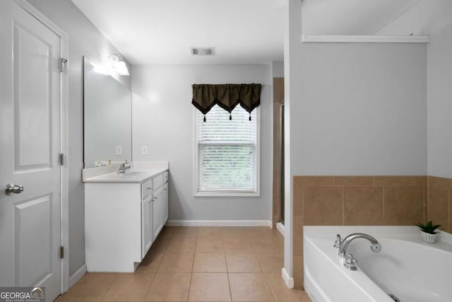 1630 Marsanne Ter NW Unit 27, Kennesaw, GA 30152 - bathroom featuring vanity, tile patterned floors, a garden tub, baseboards, and a shower with shower door