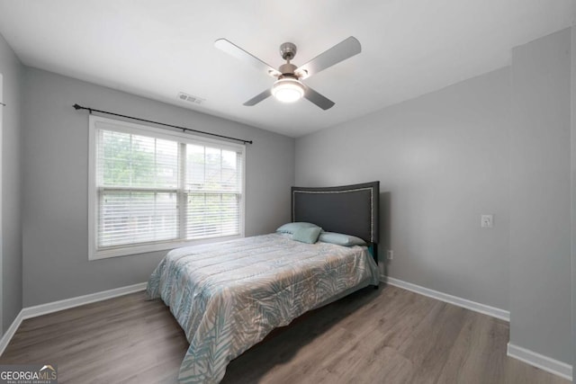 1630 Marsanne Ter NW Unit 27, Kennesaw, GA 30152 - bedroom with wood finished floors, baseboards, and ceiling fan