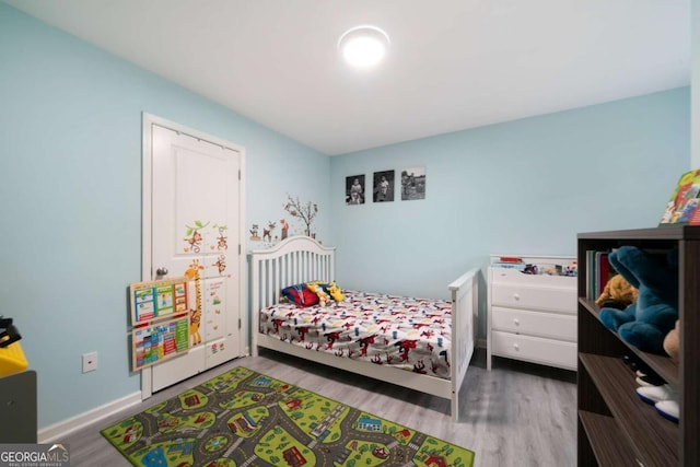 1630 Marsanne Ter NW Unit 27, Kennesaw, GA 30152 - bedroom with wood finished floors and baseboards