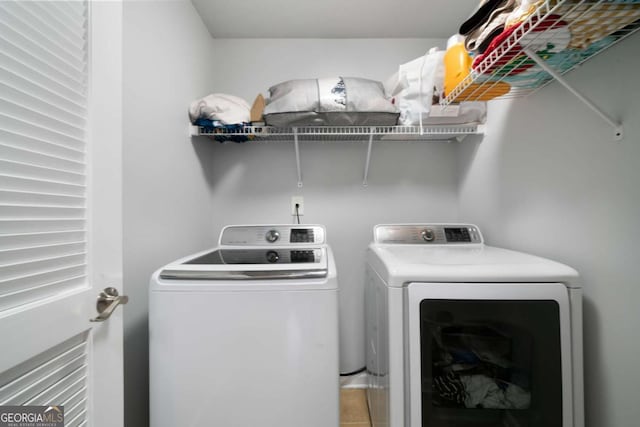 1630 Marsanne Ter NW Unit 27, Kennesaw, GA 30152 - washroom featuring washer and clothes dryer and tile patterned flooring